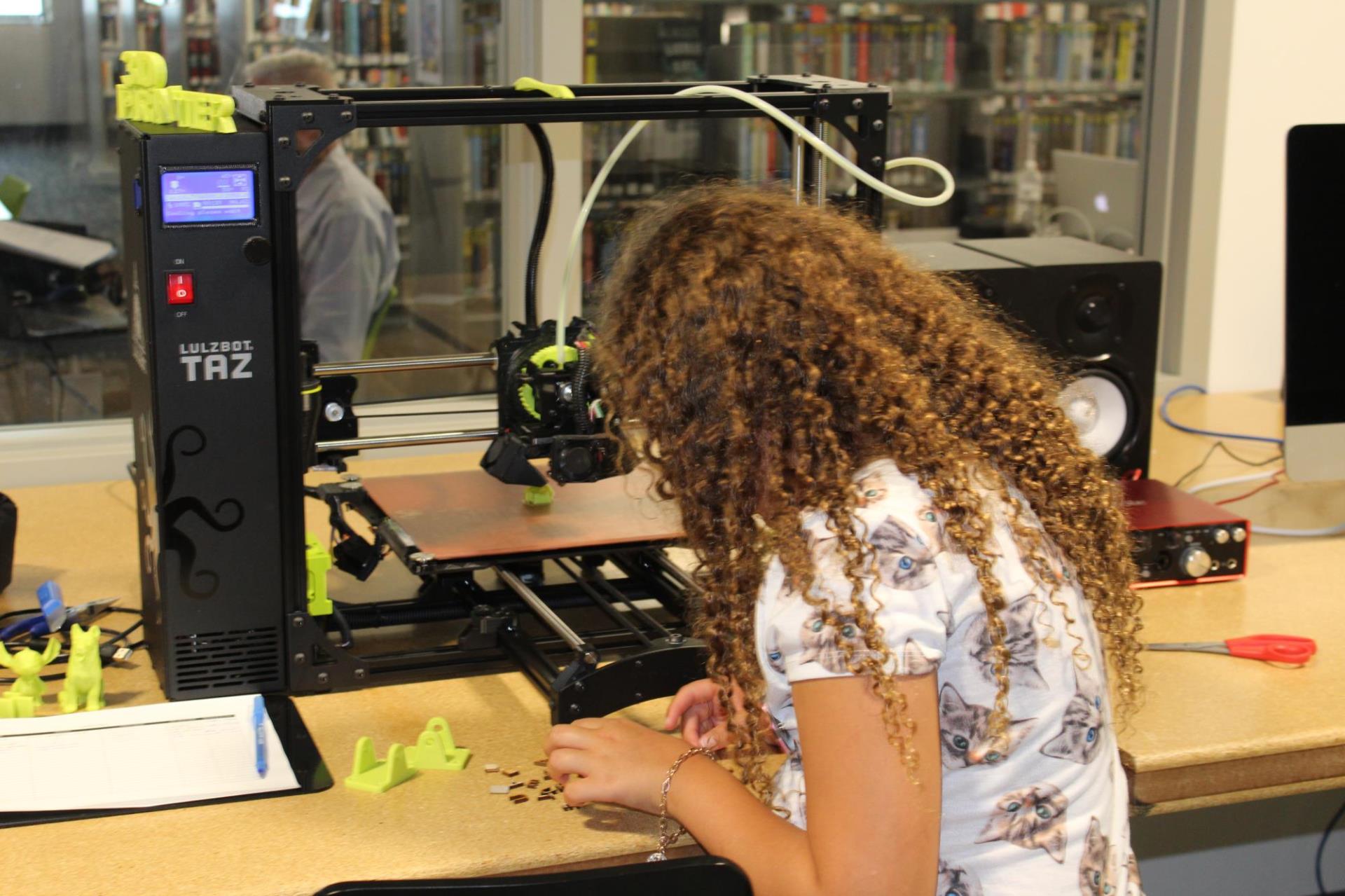 Young patron using 3D printer