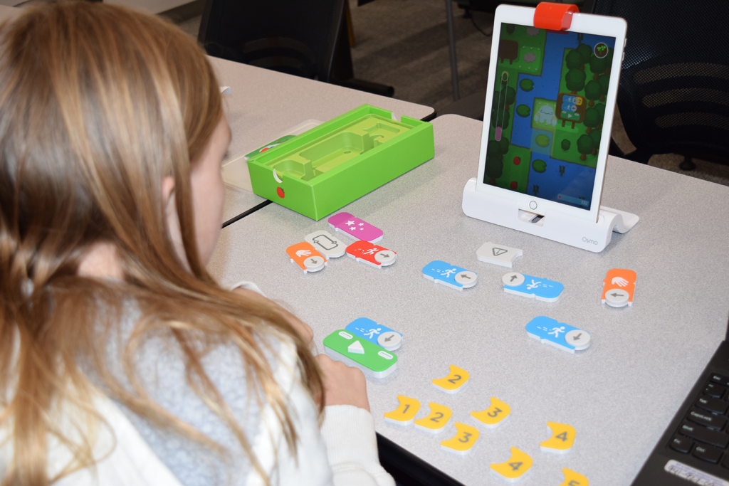 Patron learning to code with Osmo